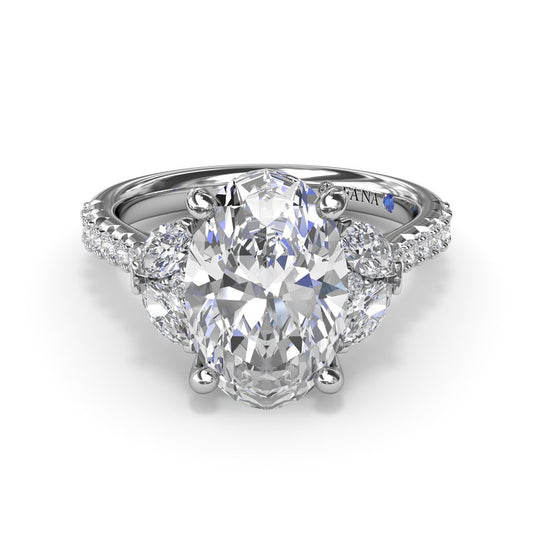 Oval diamond ring with side stones.