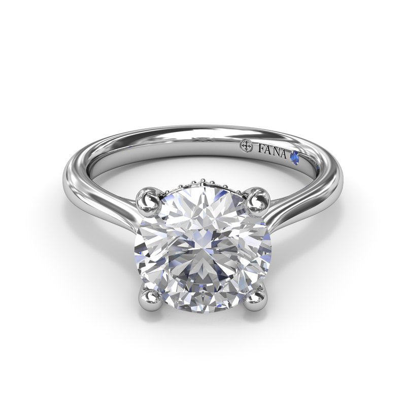Solitaire diamond ring with hidden accents.