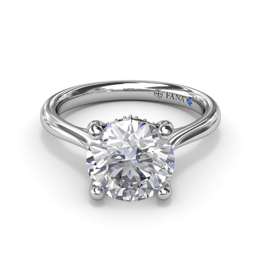 Solitaire diamond ring with hidden accents.