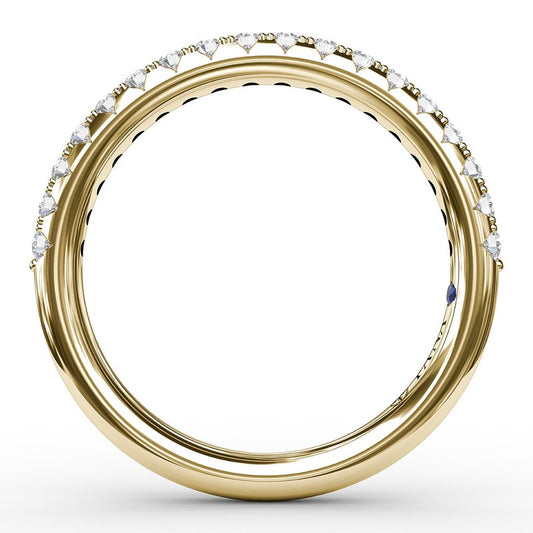Yellow gold band with diamonds and sapphire.