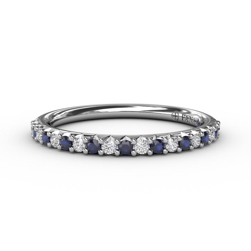 Blue sapphire and diamond band in white gold.