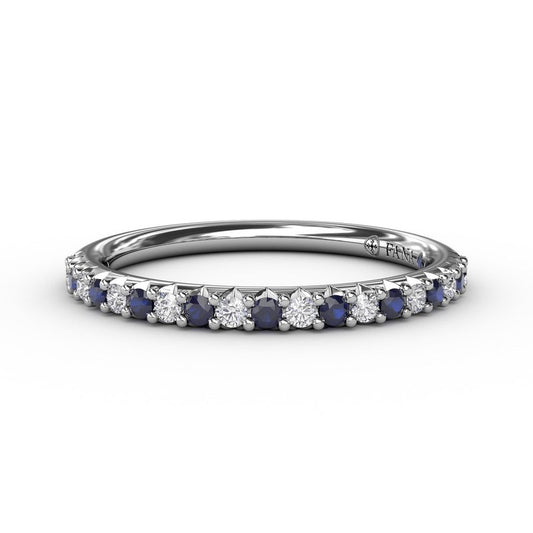 Blue sapphire and diamond band in white gold.