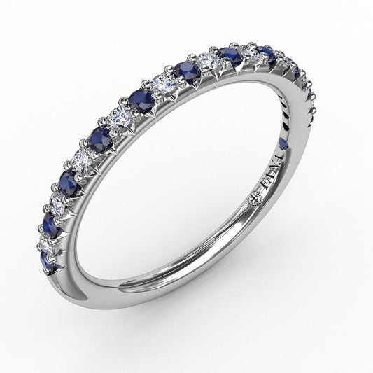 Blue sapphire and diamond band in white gold.