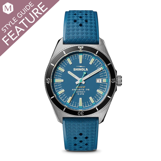 Blue dial watch with blue rubber strap.