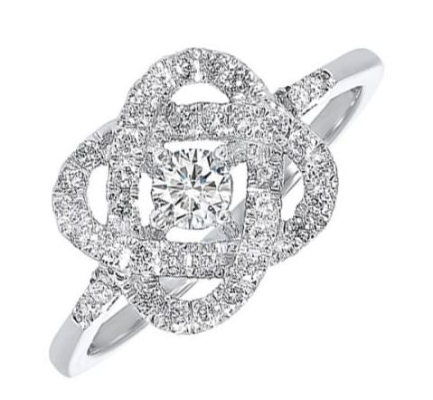 Diamond knot ring with round center stone.