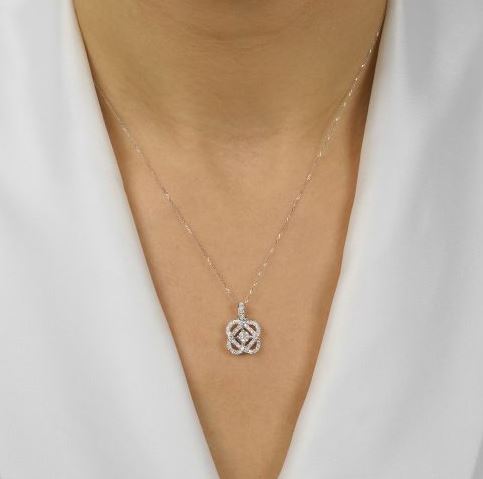 Diamond knot pendant on delicate chain.