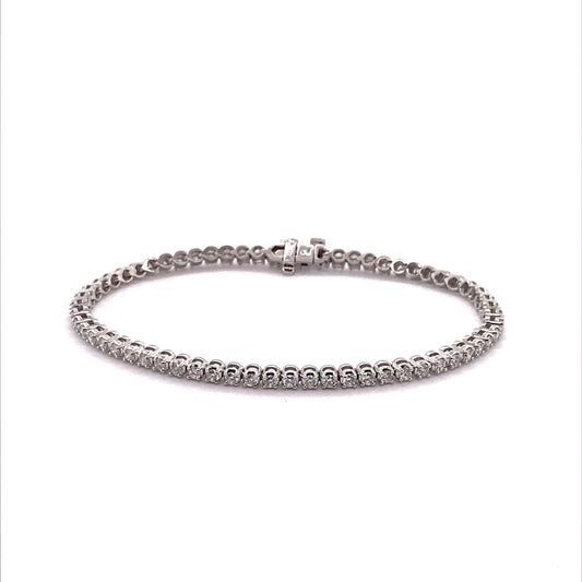 White gold diamond tennis bracelet, round stones.