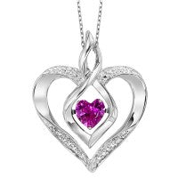 Sterling silver heart pendant with ruby centerpiece.