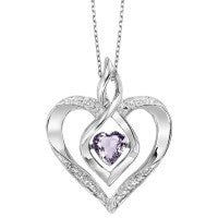 Sterling silver heart pendant with ruby centerpiece.