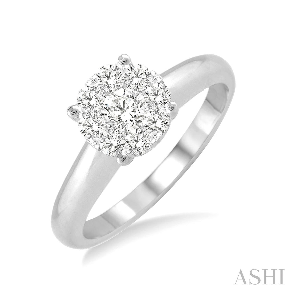 Round Diamond Cluster Engagement Ring in White Gold. Available in 0.13 ctw to 2.0 ctw.