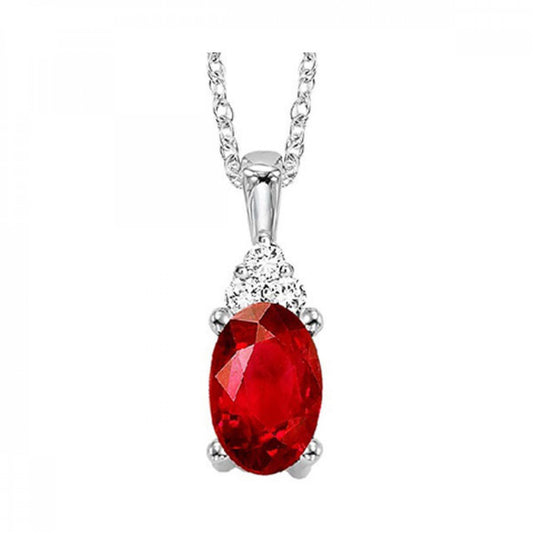 Oval ruby pendant with diamond accents.