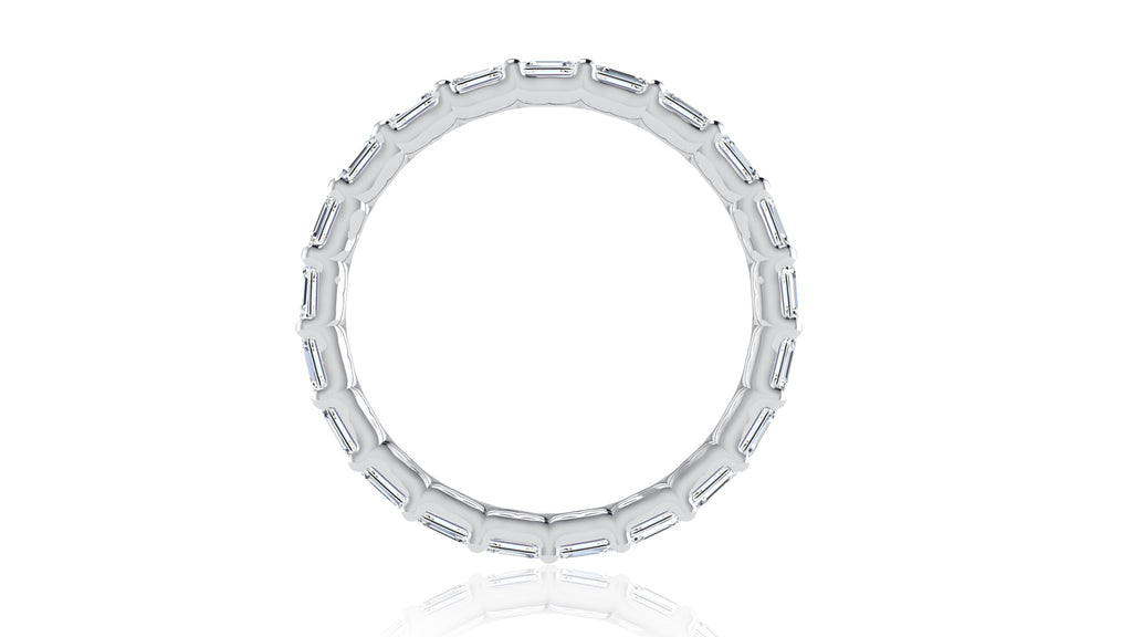 East-west emerald cut diamond band in white gold.