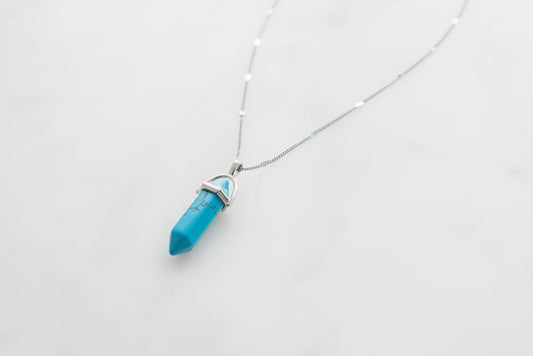 Turquoise gemstone on sterling silver chain.