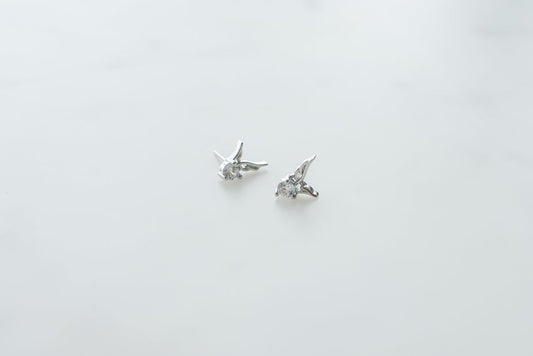 Sterling silver earrings with diamond accents.