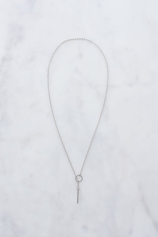 Sterling silver necklace with circular pendant.